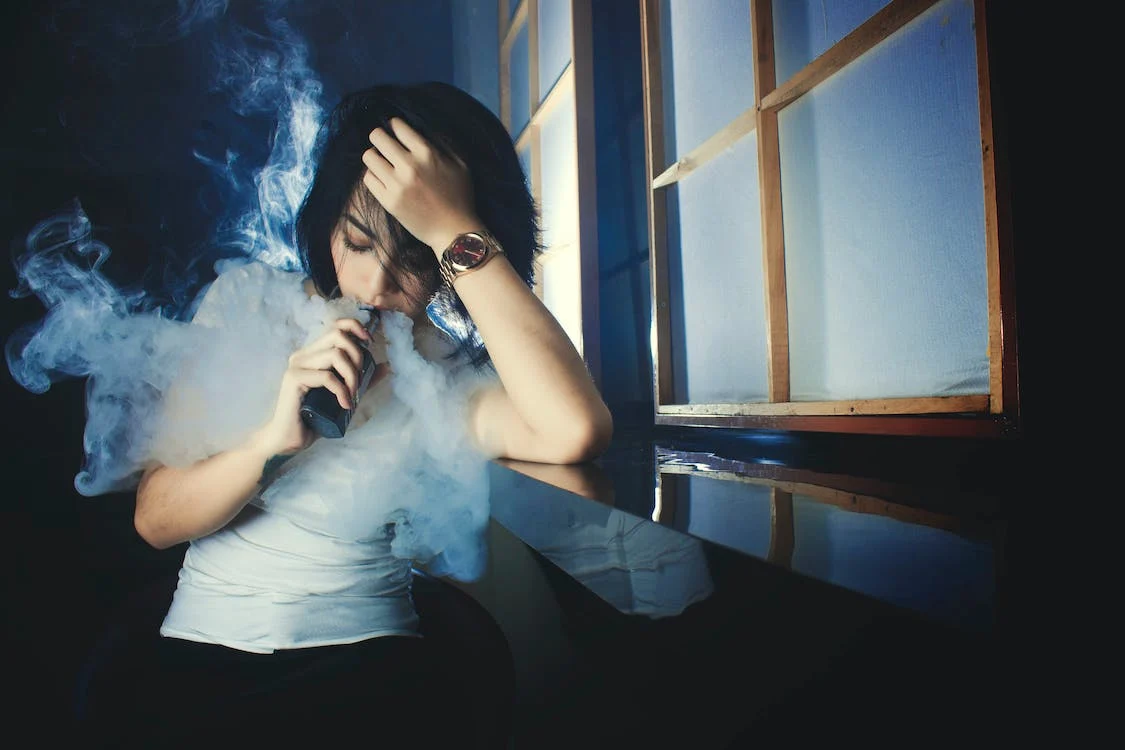 Beautiful girl vaping in room alone ,Without nicotine vapes and smokes, Disposable vapes and smokes, chargeable vape pen, Foodgod, mega, myle, Juul, Flum, suorin, puff, air bar, hide all these vapes and smokes are available.